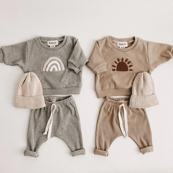 Set van regenboog- en sunnie-sweaters voor kinderen