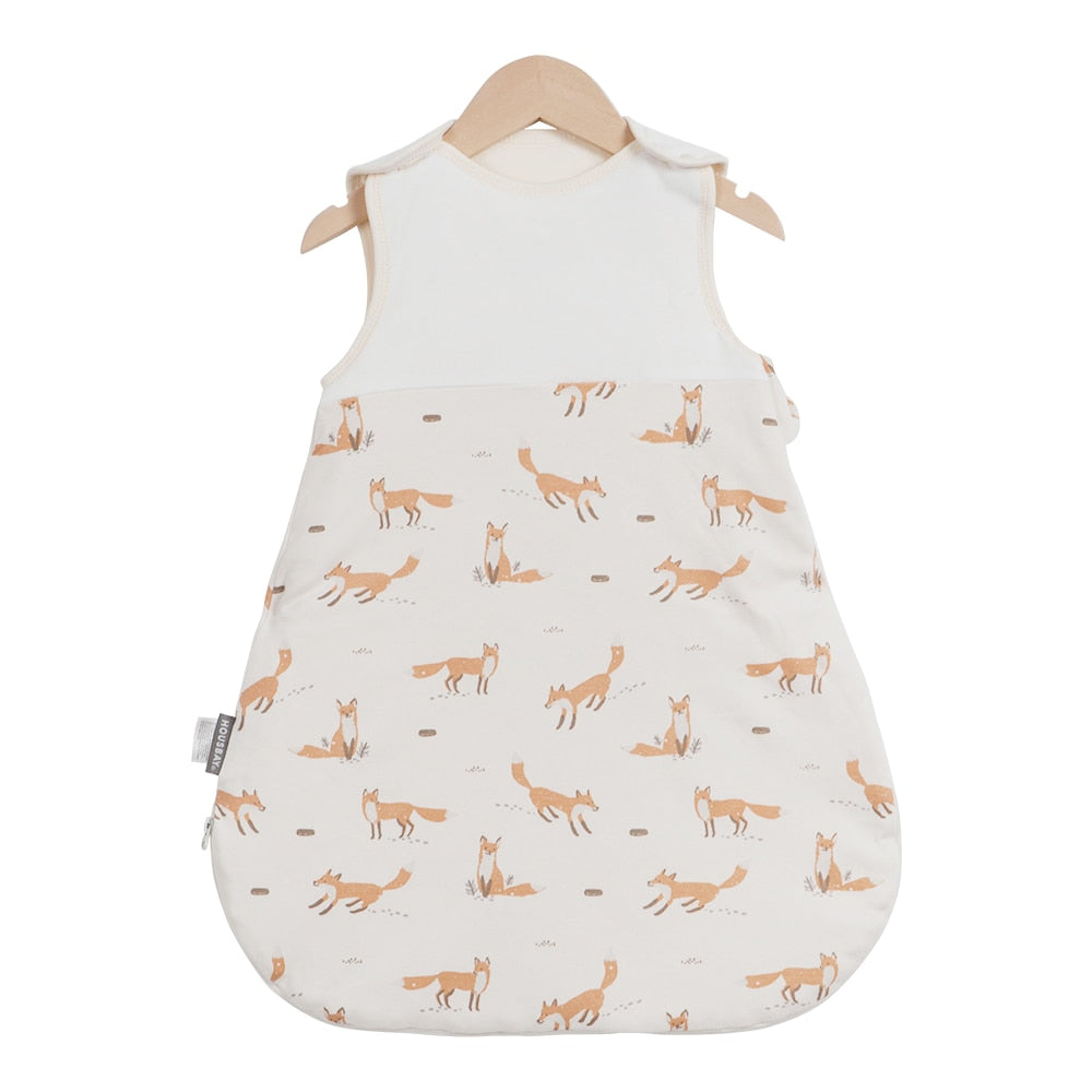 baby wearing a sleeveless sleep bag, suitable for ages 0-2 years with a 0.5 TOG rating for warmth  product variation FOX